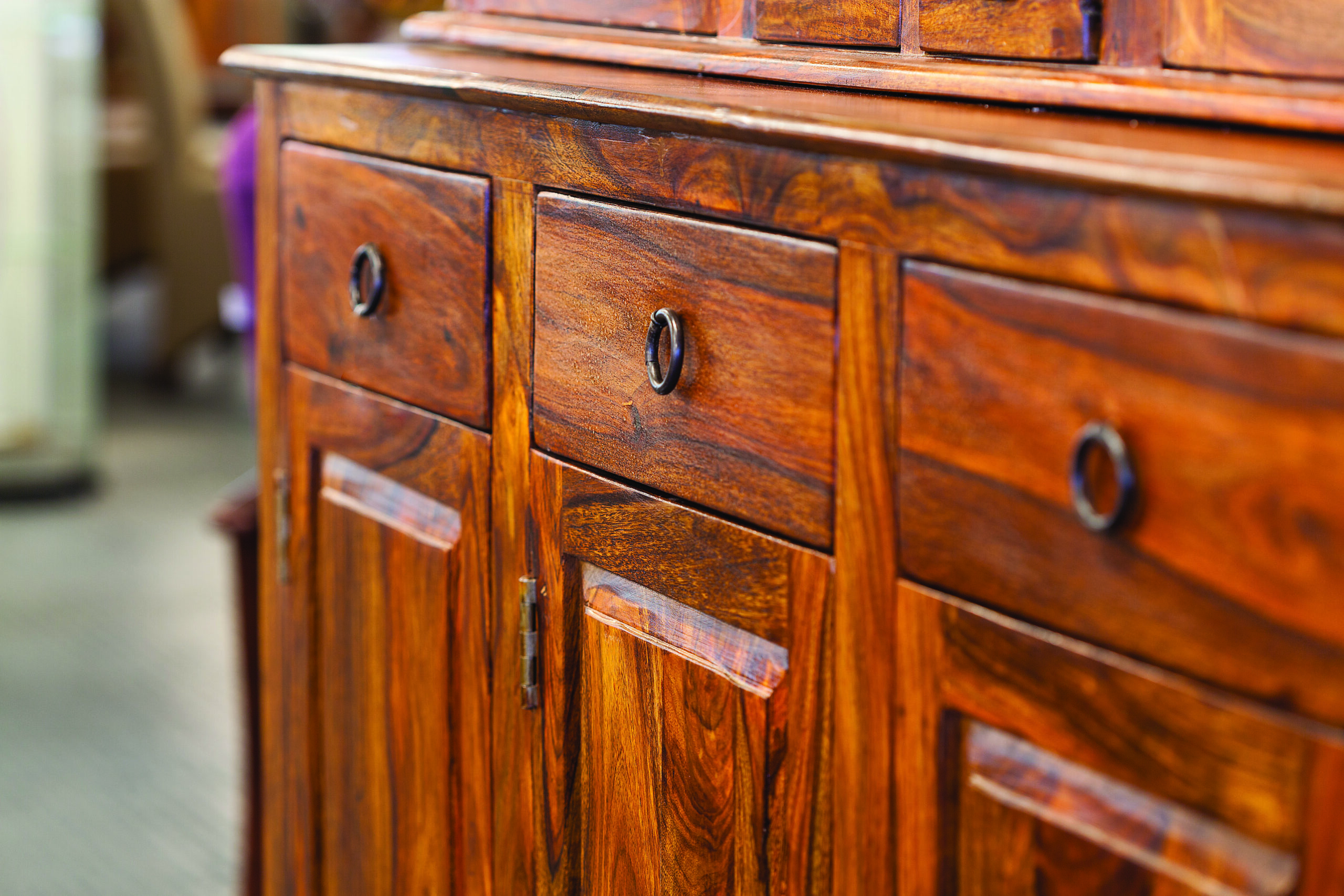 Wooden cabinet with drawers and handles